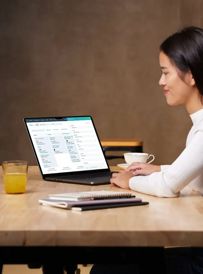 Person working on a laptop with a HubSpot automation workflow displayed. Person working on a laptop with a HubSpot automation workflow displayed.